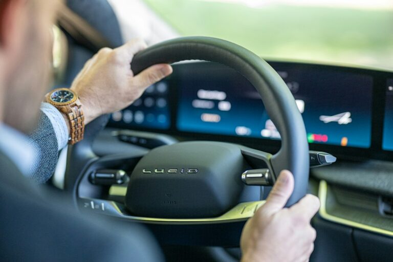 Man driving electric car - 2023 Lucid Air — illustrative photo for lucid air interior and features