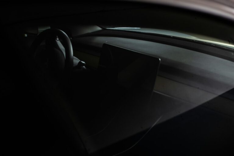 the interior of a car with a steering wheel — illustrative photo for premium ev cabin and comparison